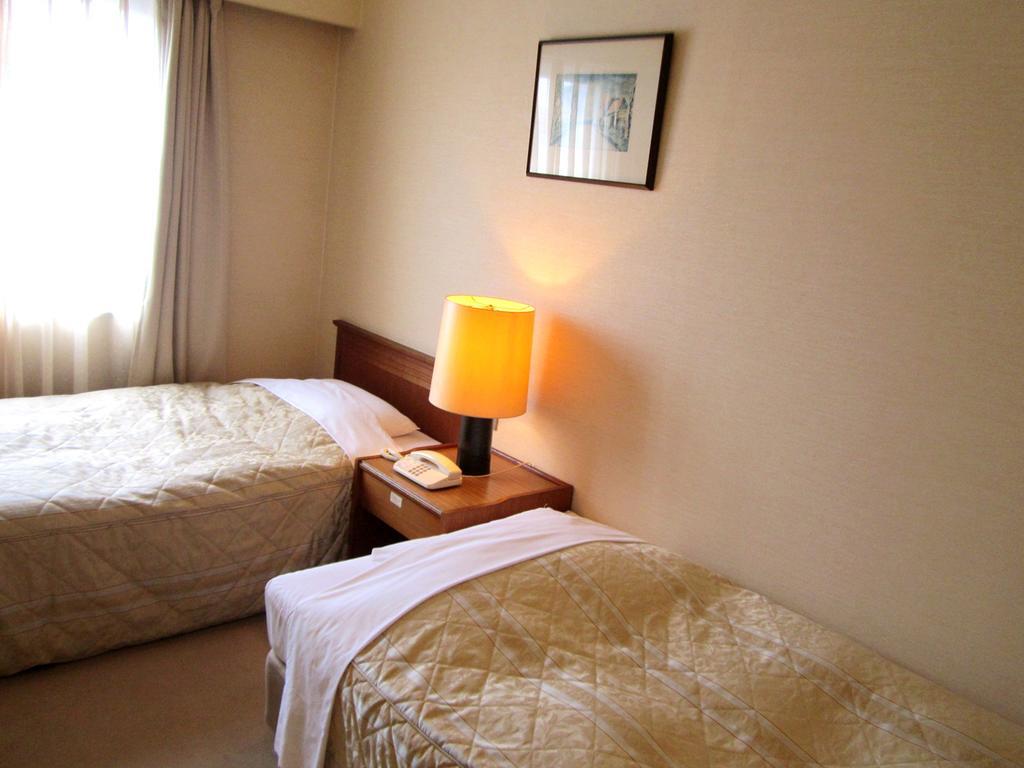 Hotel Pearl City Kurosaki Kitakyushu Bagian luar foto